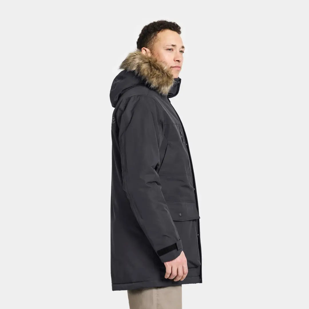 Dark gray Didriksons Marco Parka 3 with fur-trimmed hood, perfect for country clothing adventures