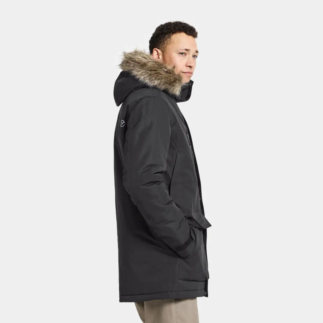 Dark winter parka with fur-trimmed hood, perfect for hunting and outdoors adventures