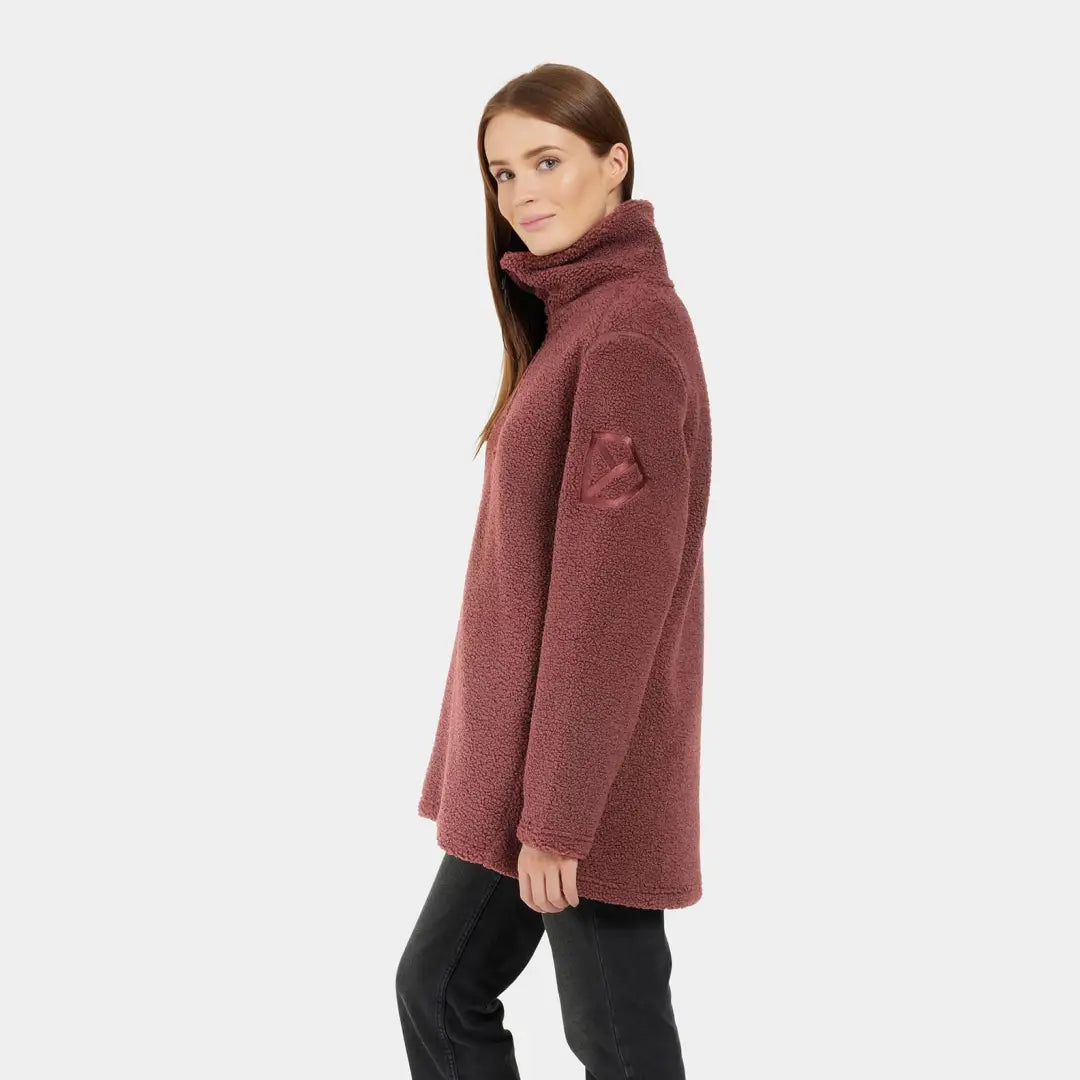 Woman wearing a mauve Didriksons Marina Half Zip Fleece jacket with high collar