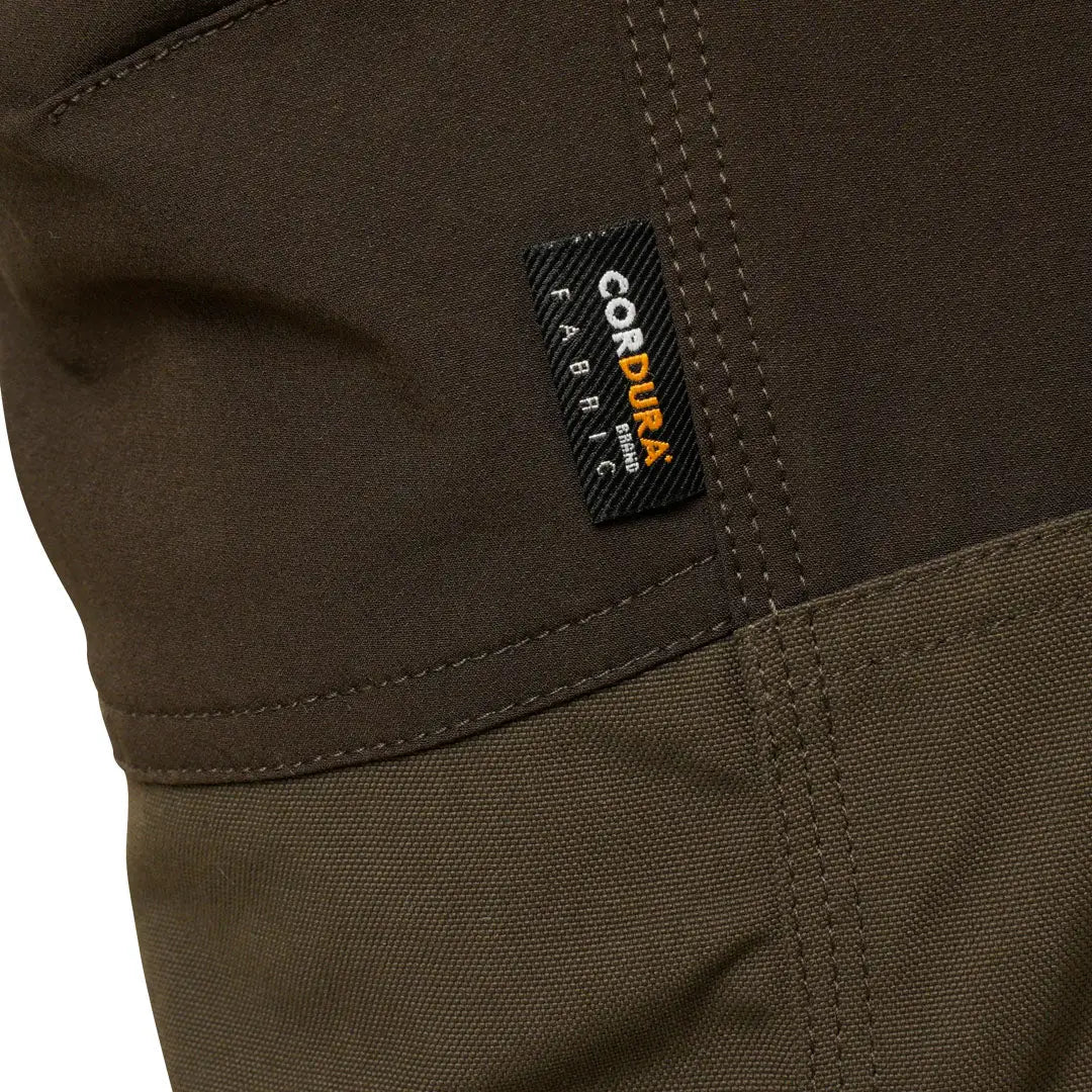 Close-up of a brown Harehill Ridgegate Waterproof Trouser with Goretex label