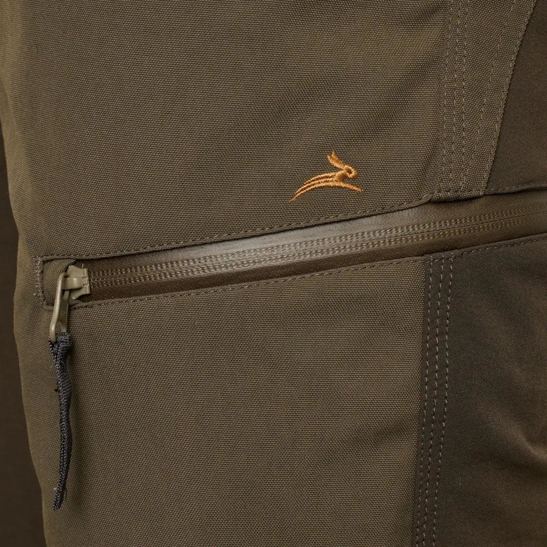 Olive green Ridgegate Waterproof Trouser with zipper pocket and orange logo