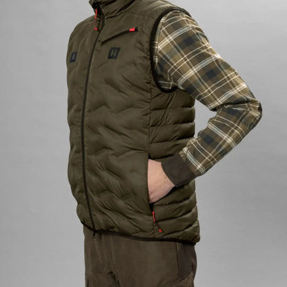 Olive green Clim8 Insulated Waistcoat over a plaid flannel shirt for a stylish look