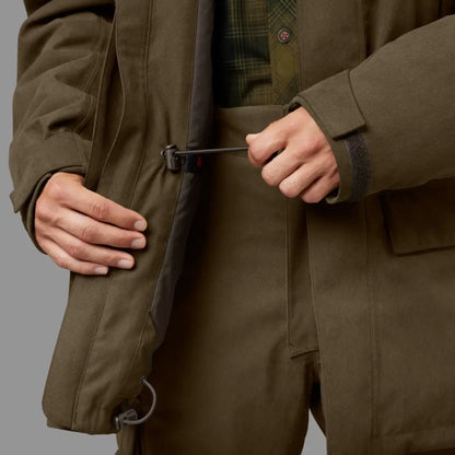 Olive green Harkila Driven Hunt HWS insulated jacket with waist belt being fastened