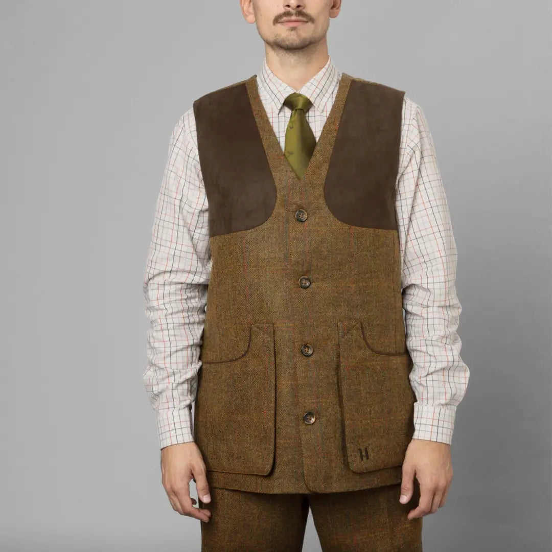 Olive-brown Kenmore Shooting Waistcoat over a checked shirt and green tie