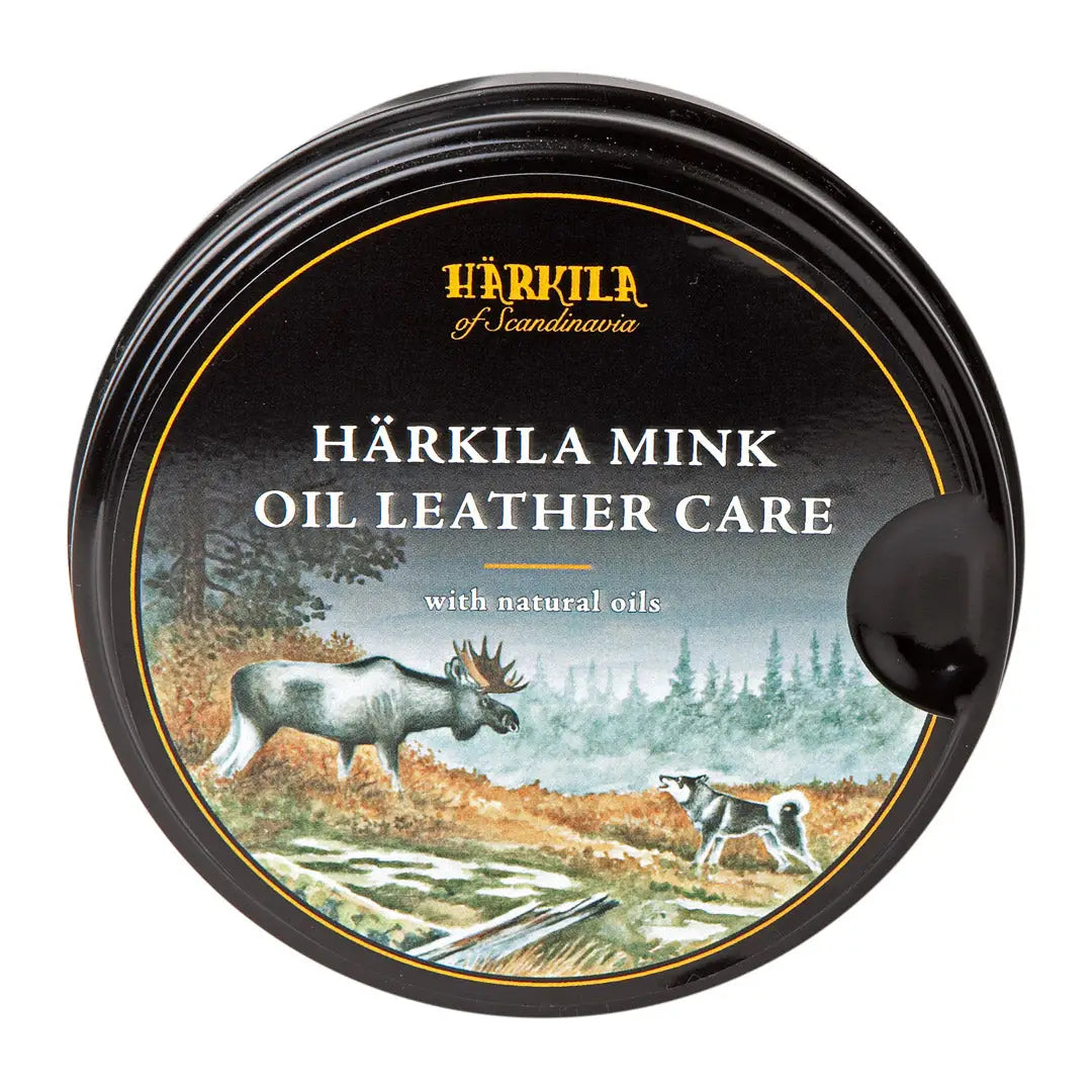 Härkila Mink Oil Leather Care tin with nature scene, moose, and dog on the lid