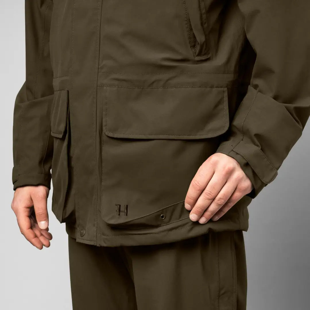 Olive green Harkila Orton Tech HWS Jacket, a classic hunting jacket with pockets