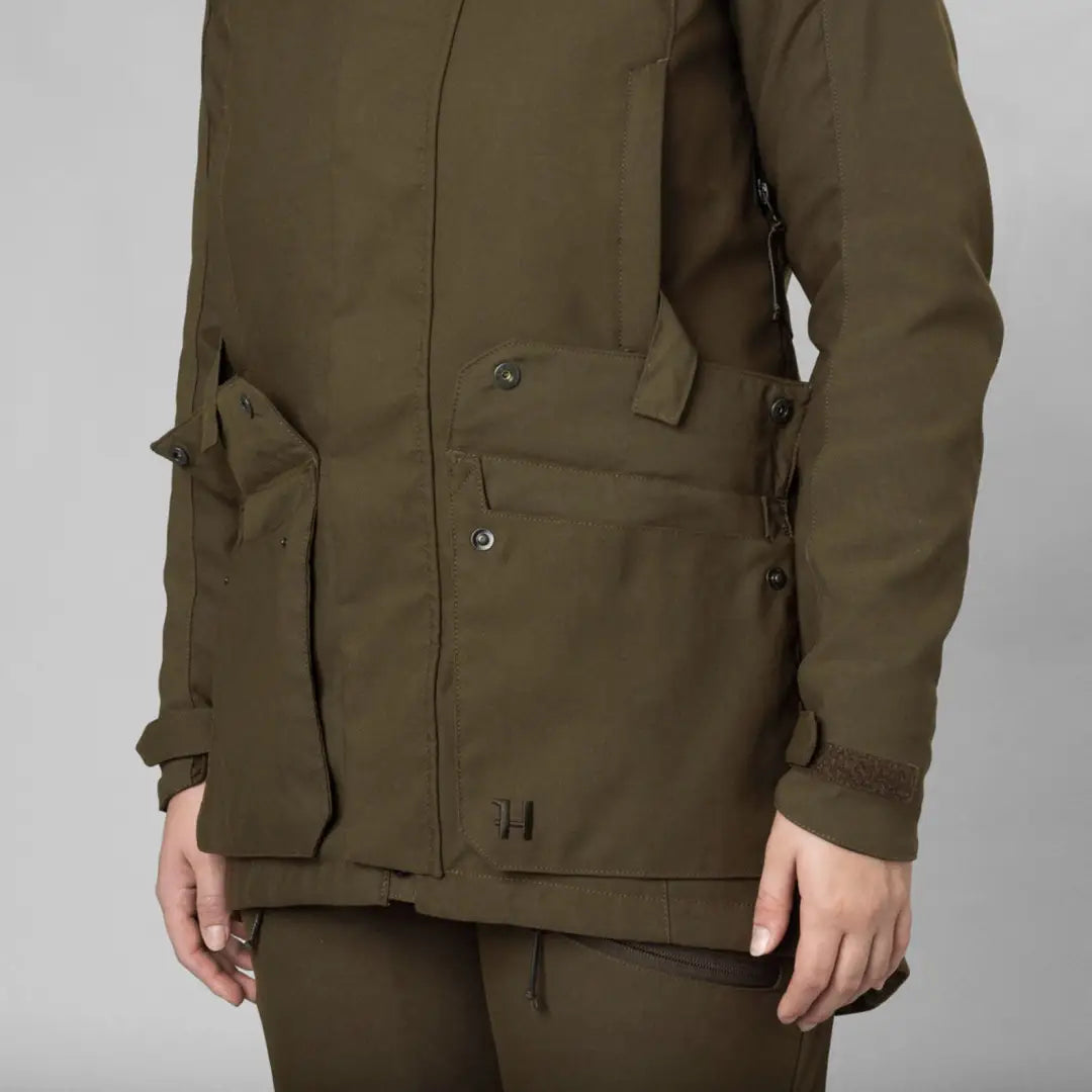 Olive green Harkila Pro Hunter GTX Ladies Jacket with pockets and buttons for outdoor adventures