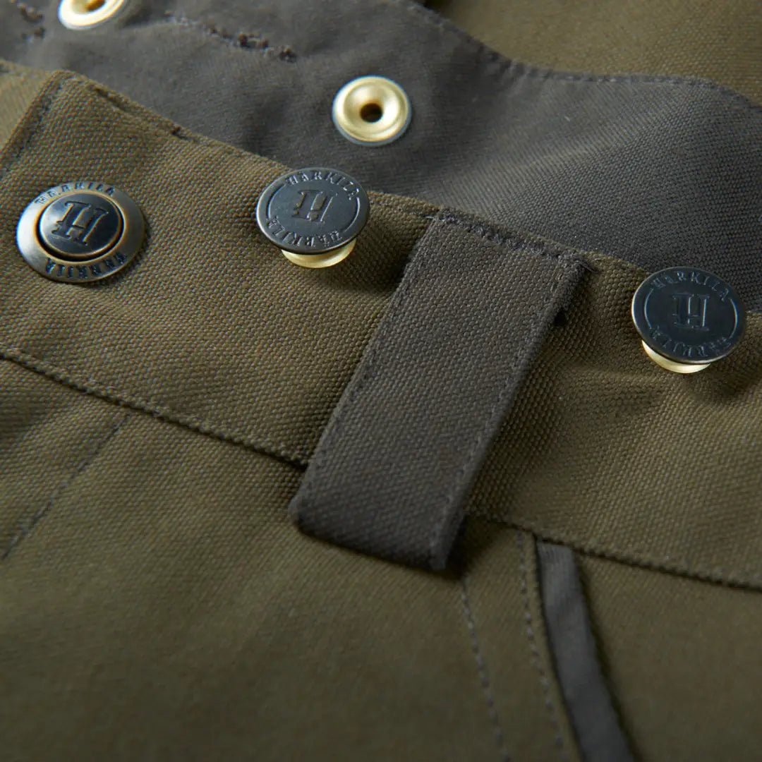 Olive green Harkila Pro Hunter Move Trousers with metal buttons and thigh pockets