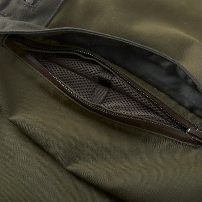 Zippered mesh pocket on olive green Harkila Pro Hunter Move Trousers for strength and style