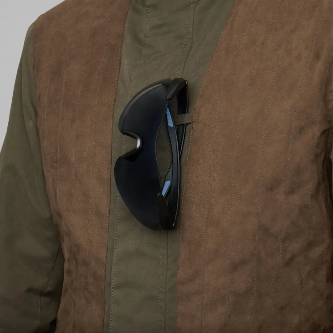 Sunglasses in pocket of Harkila Rannoch HWS Shooting Jacket for stylish outdoor adventures