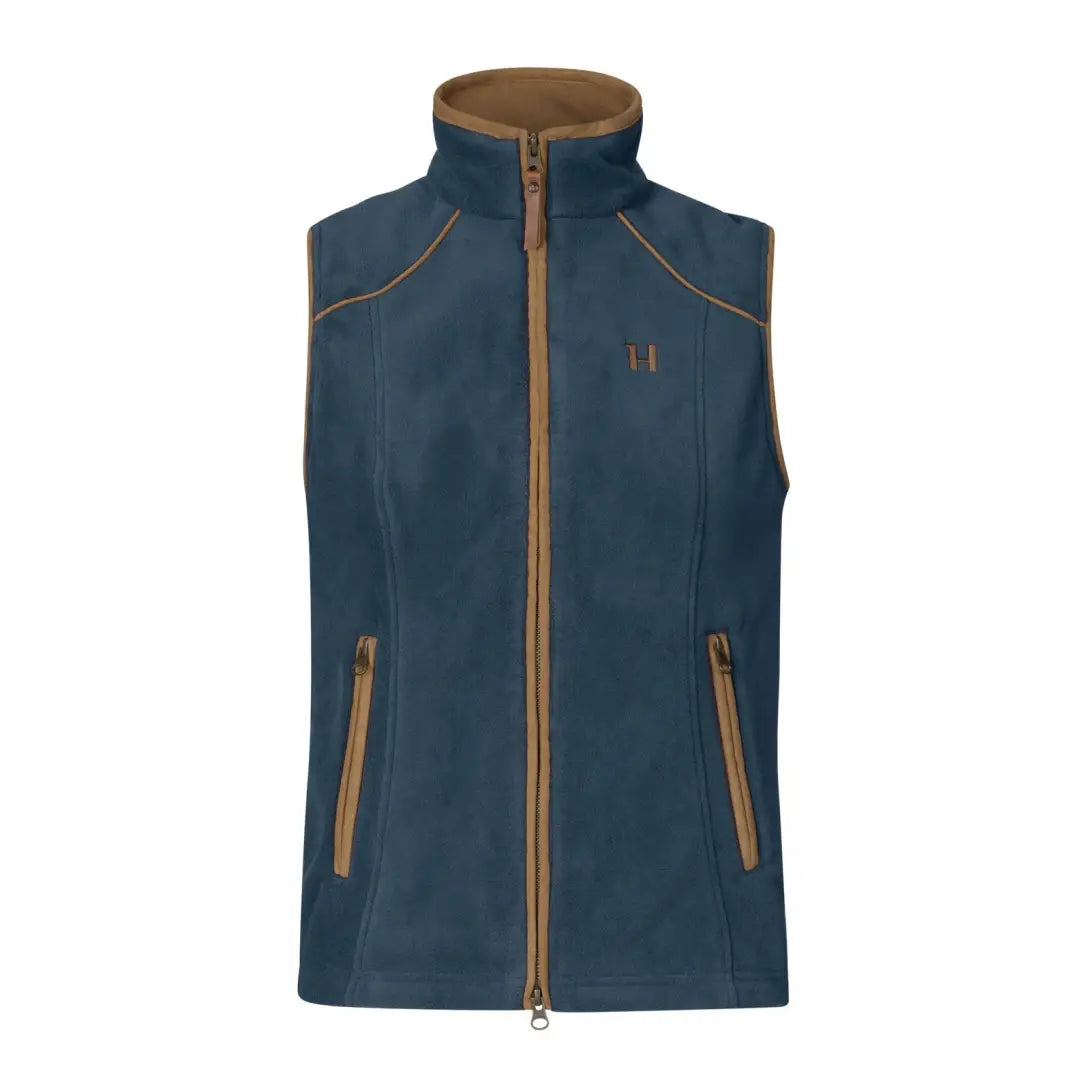 Blue sleeveless vest featuring a brown zipper, stylishly fits the female figure perfectly