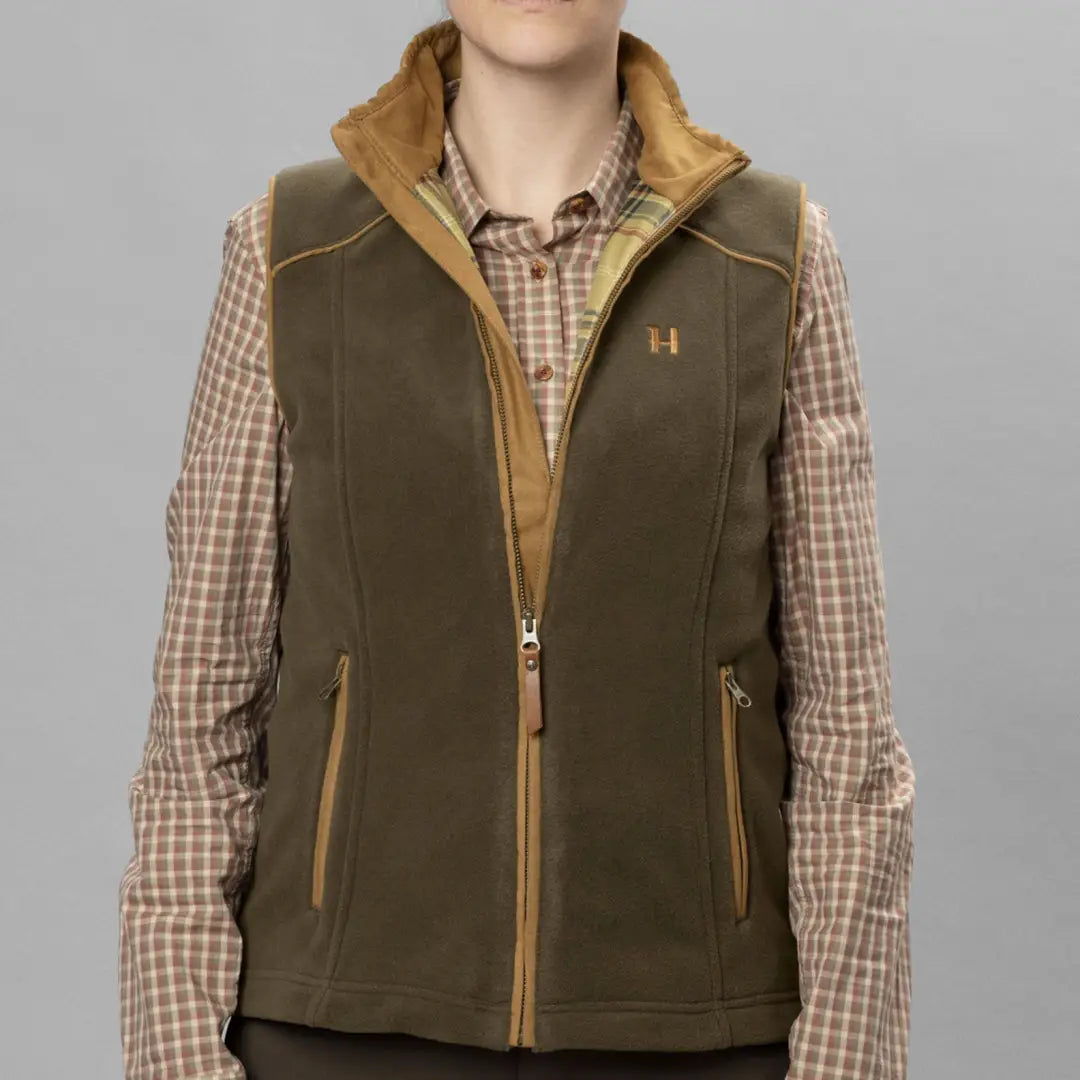 Olive green stylish fleece vest with tan trim and gold zipper, perfect for female figure