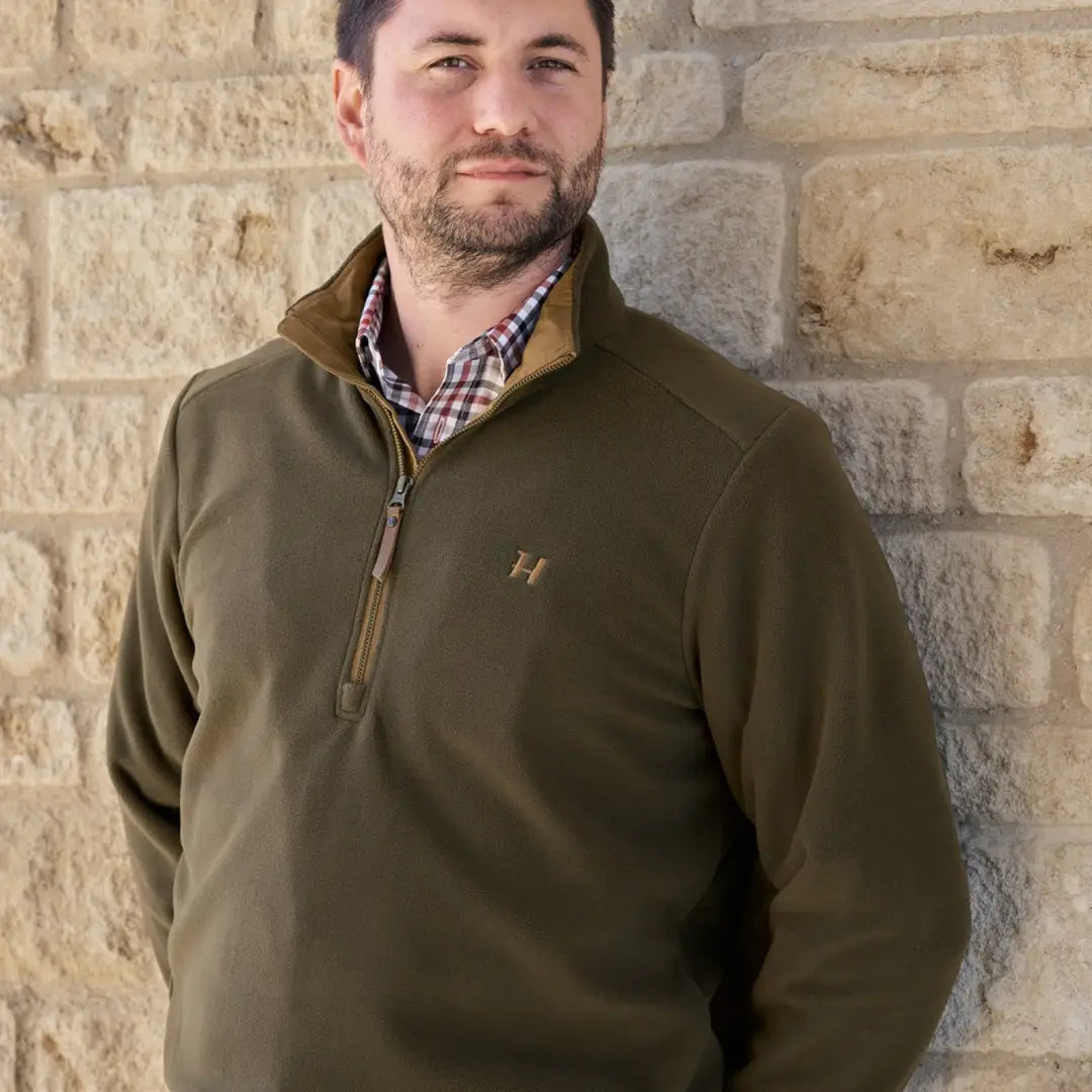 Man in olive green fleece pullover from Harkila Sandhem, perfect for country clothing and hunting