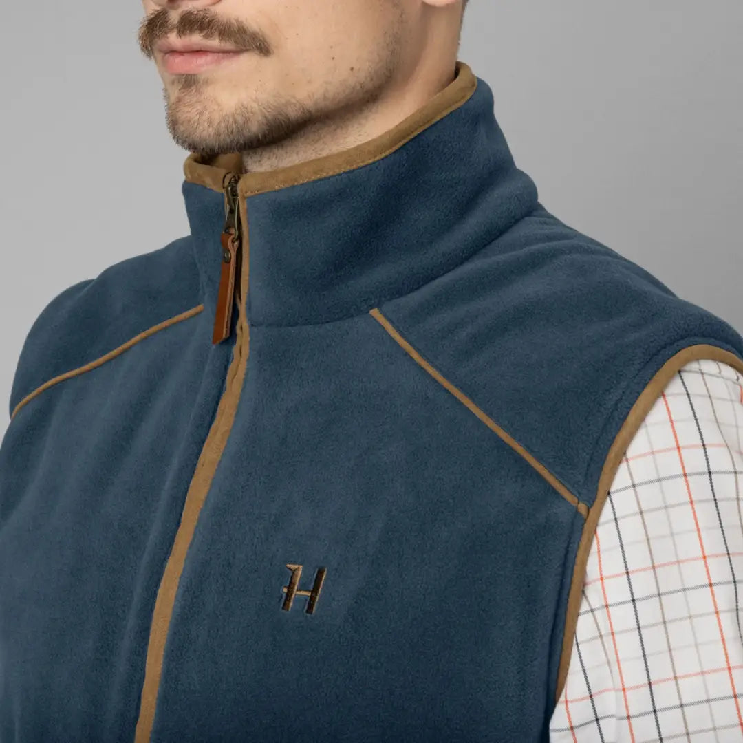 Navy blue fleece vest with tan trim, perfect for Harkila Sandhem country clothing and hunting