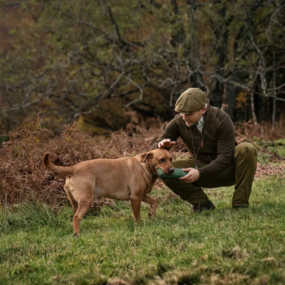 Man in countryside attire with dog wearing Sandhem Pro Insulated Cardigan outside