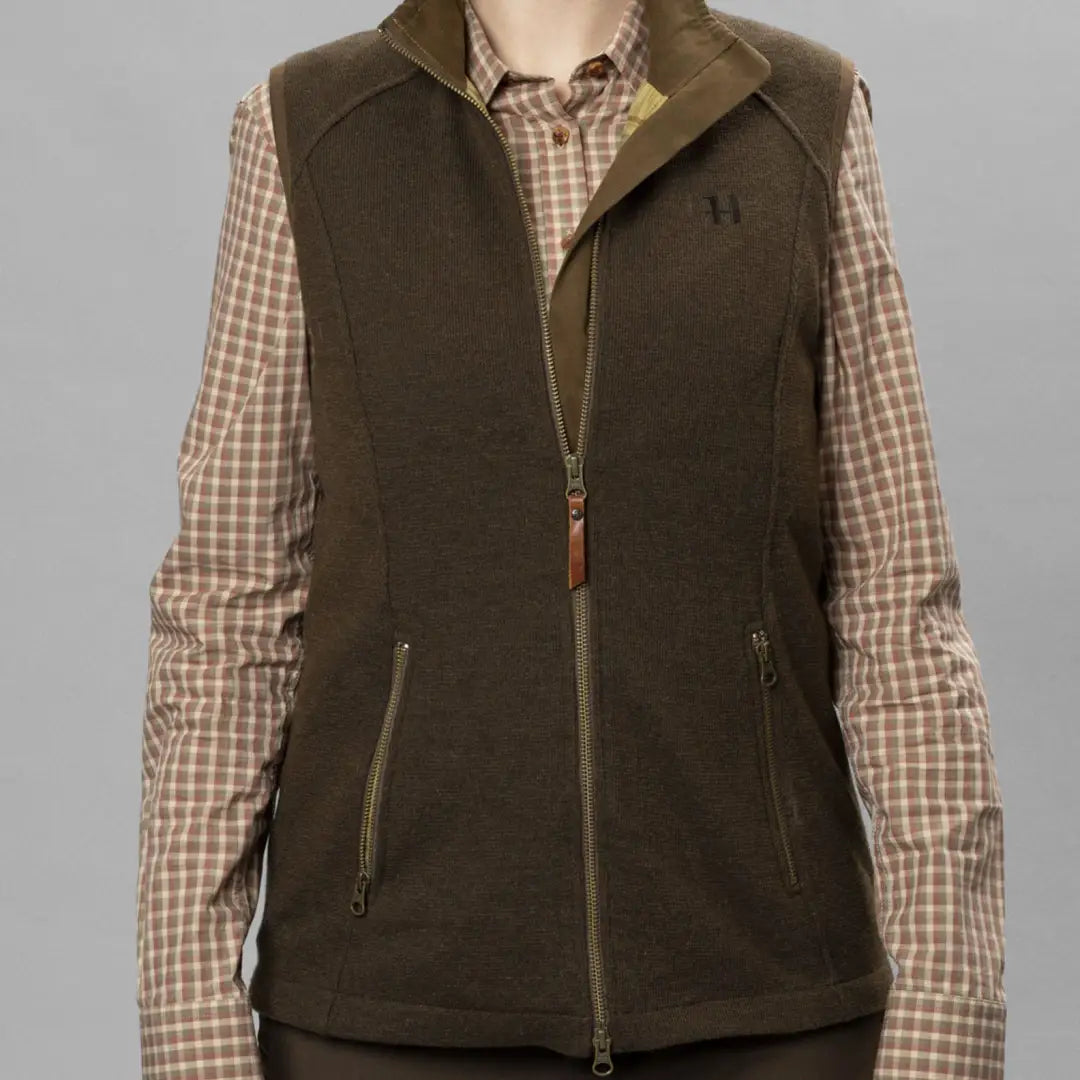 Dark green Sandhem Pro Waistcoat over brown checkered shirt, ideal for outdoor adventures