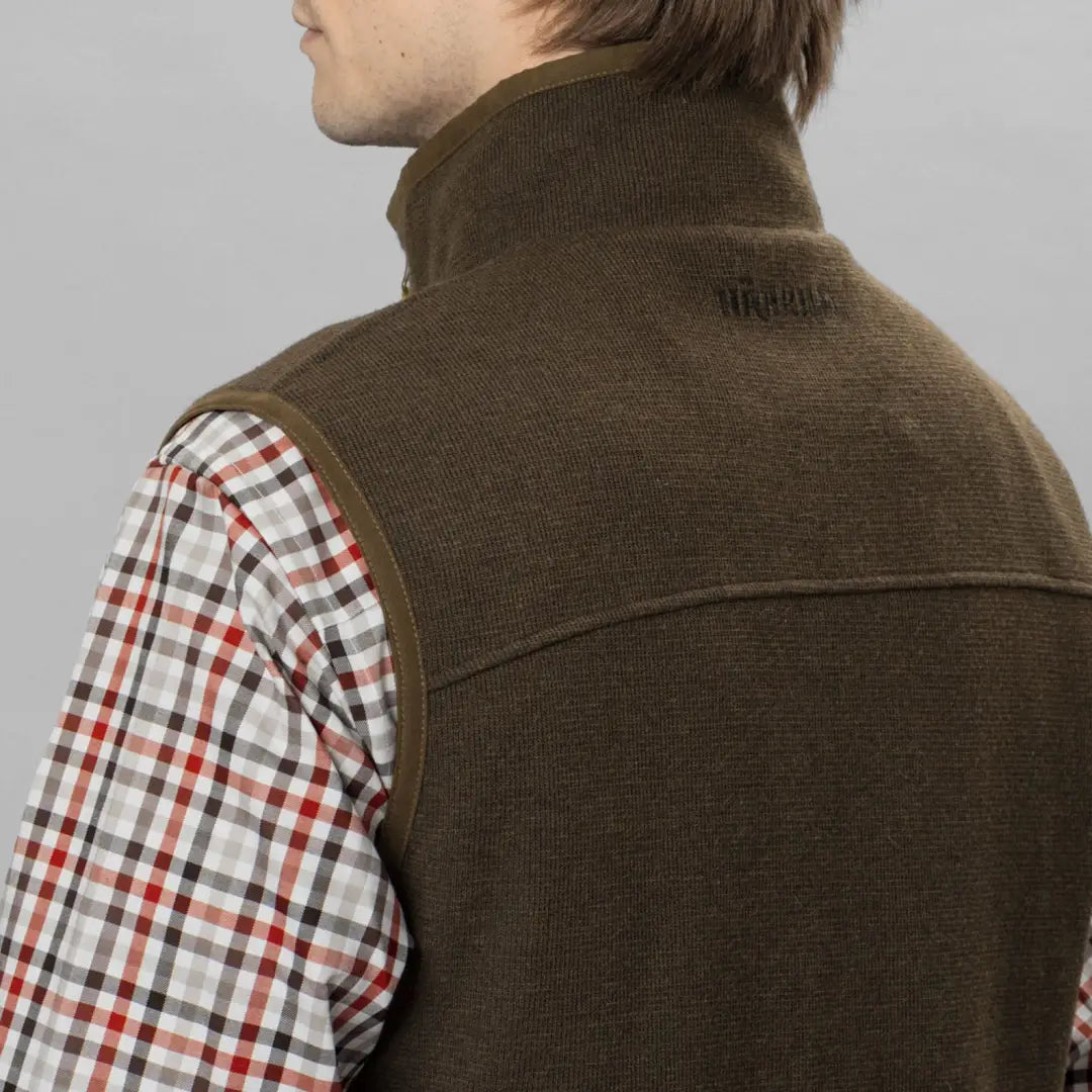 Brown knitted vest over plaid shirt, perfect for the Harkila Sandhem Pro Waistcoat style