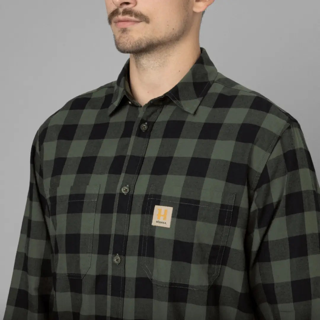 Green and black plaid flannel Harkila Scandinavian Long Sleeve shirt with logo patch