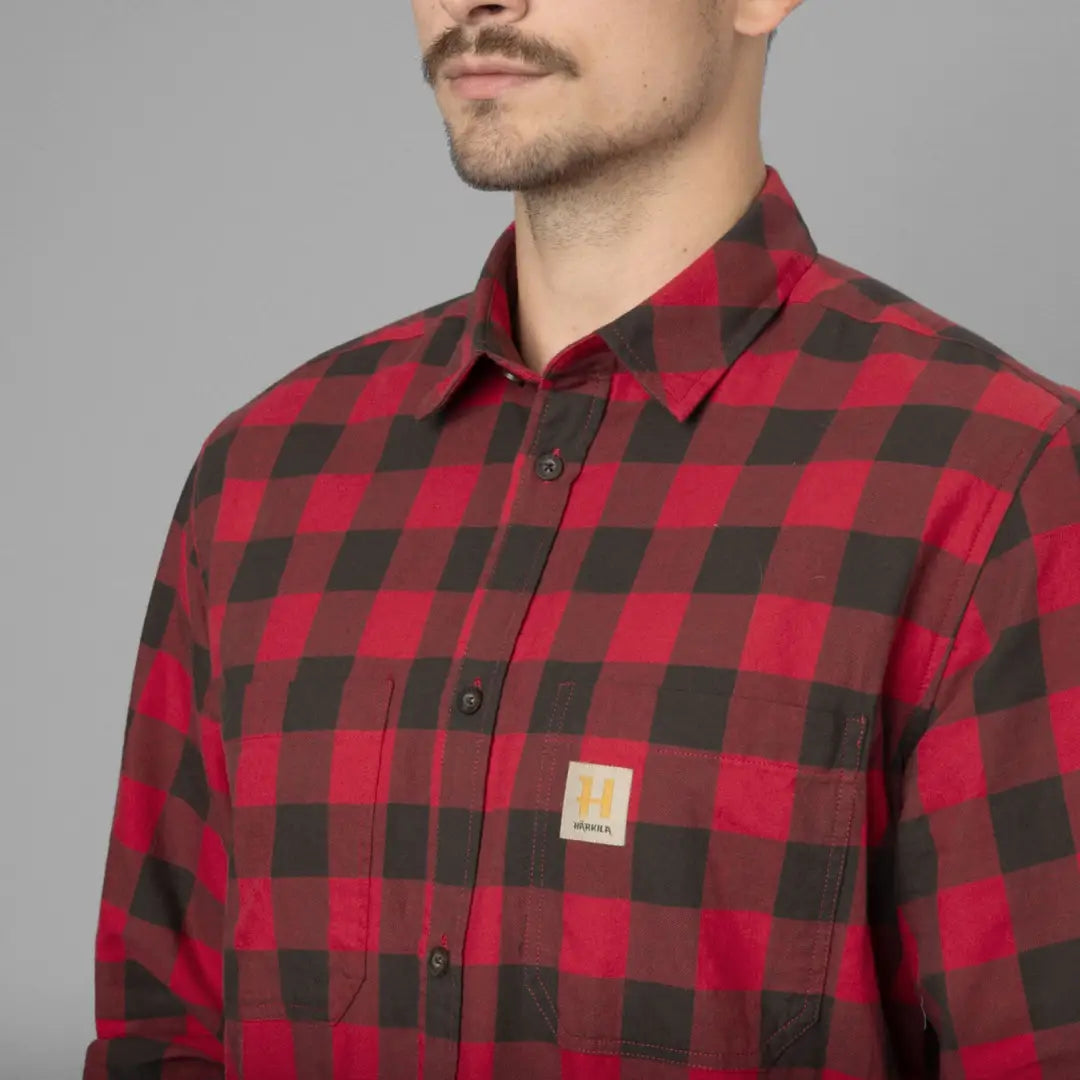 Red and black checkered Härkila Scandinavian Long Sleeve Shirt, a durable choice designed for style