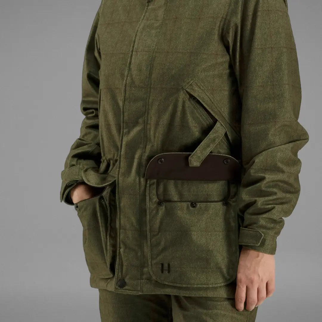 Military-style olive green Harkila Stornoway Shooting Lady Jacket with pockets and belt