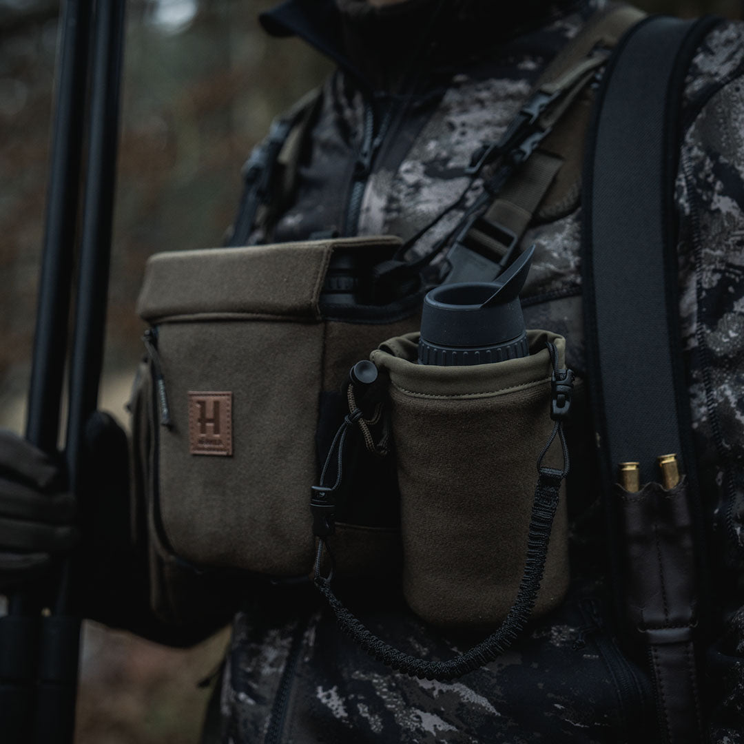 Chest-mounted binocular pack in Harkila Thermal Spotter Pouch for hunting and outdoors