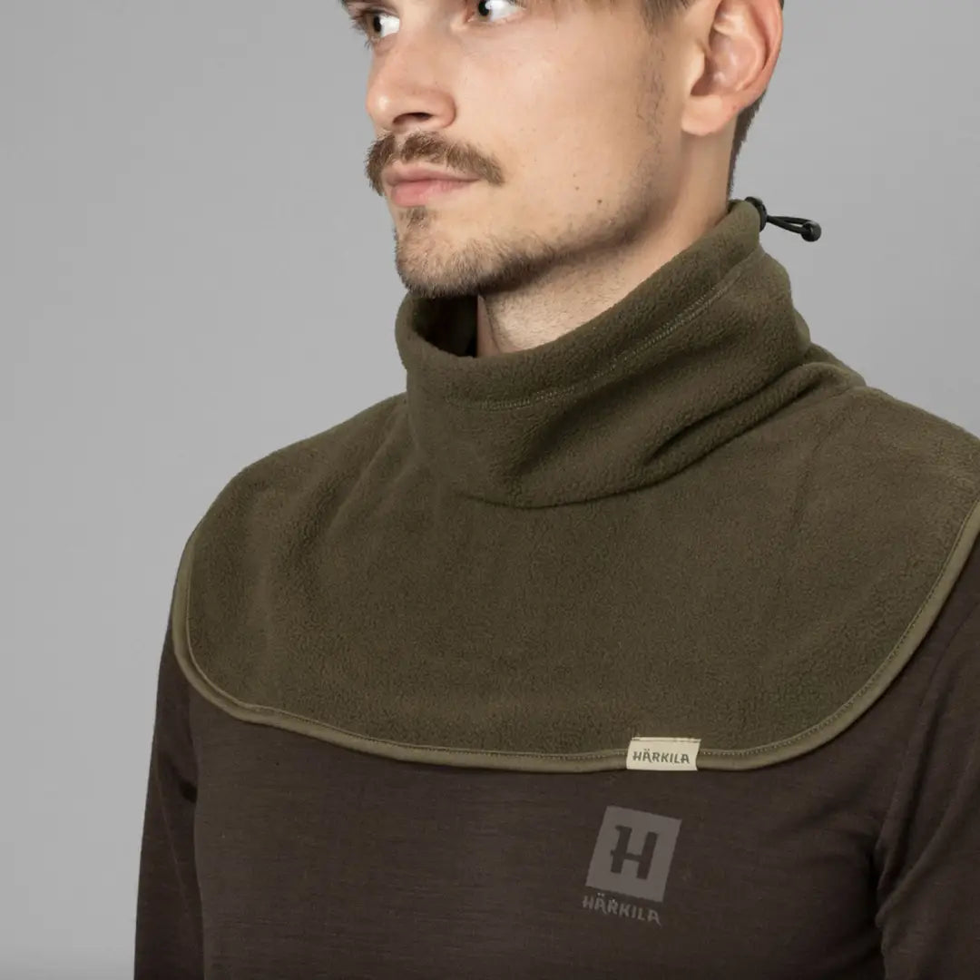 High-necked olive green and brown Harkila Trygve Neck Gaiter with logo patch