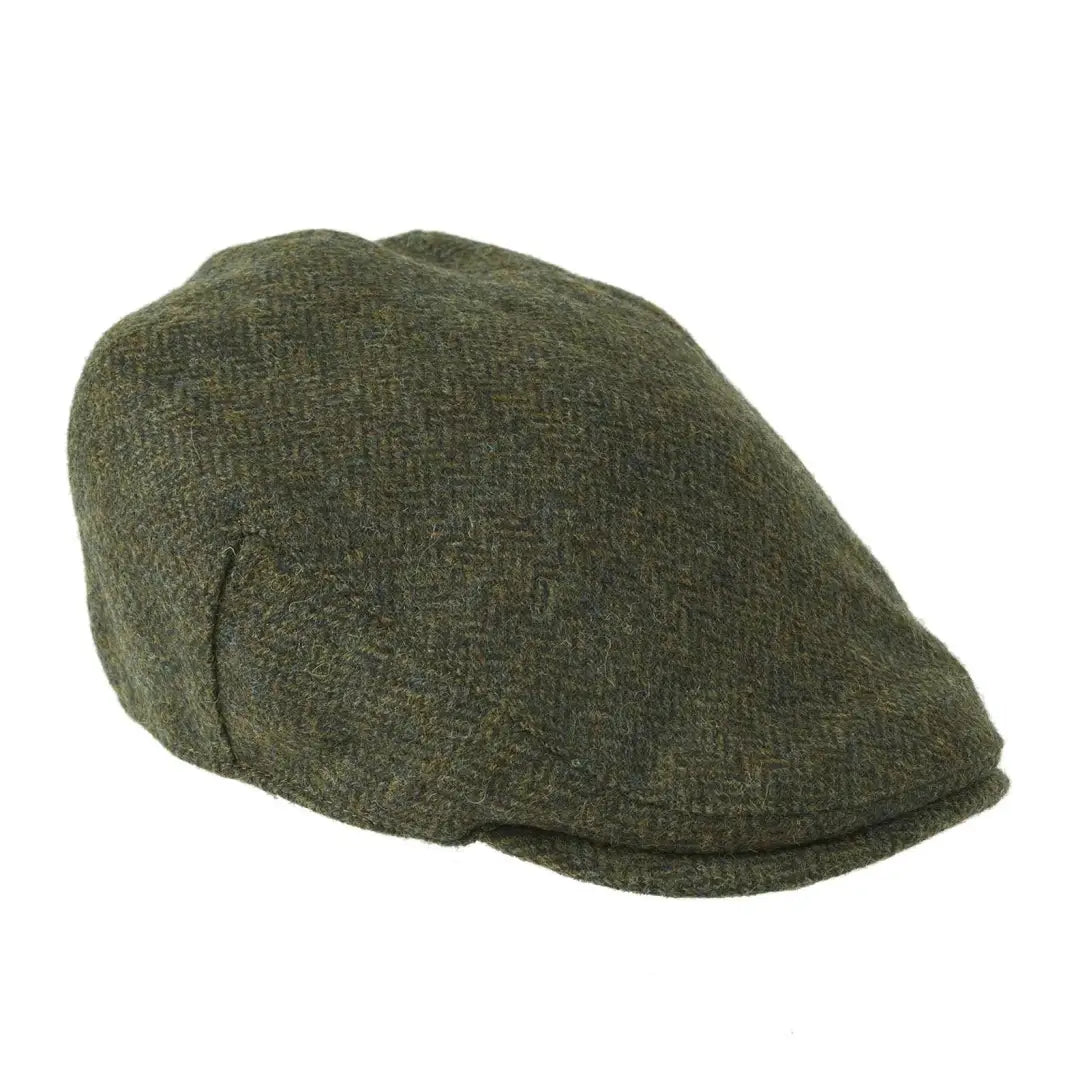 Dark green British Tweed flat cap with herringbone pattern by Heather Chapman