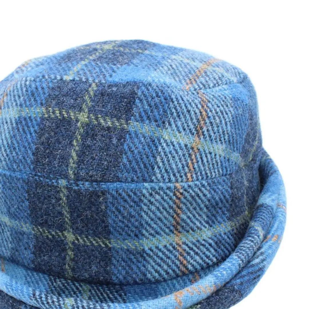 Blue plaid wool hat with a rounded crown, part of the Heather Fenella Harris Tweed collection