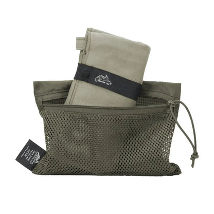 Mesh storage bag with a folded Helikon-Tex Field Towel, perfect for country clothing and hunting