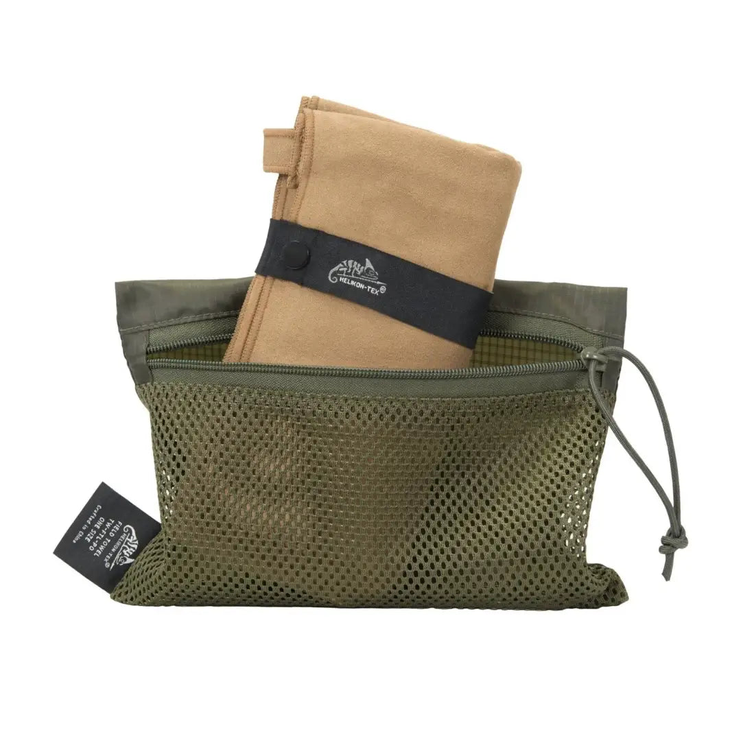 Olive green mesh bag with folded tan Helikon-Tex Field Towel for country clothing and hunting