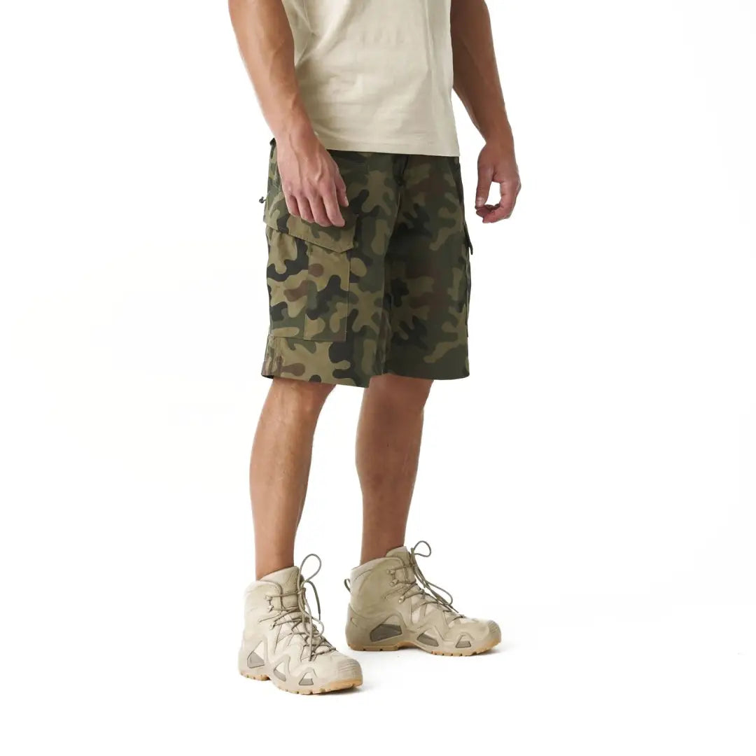 Camouflage cargo shorts on a person, perfect for hunting and outdoor adventures