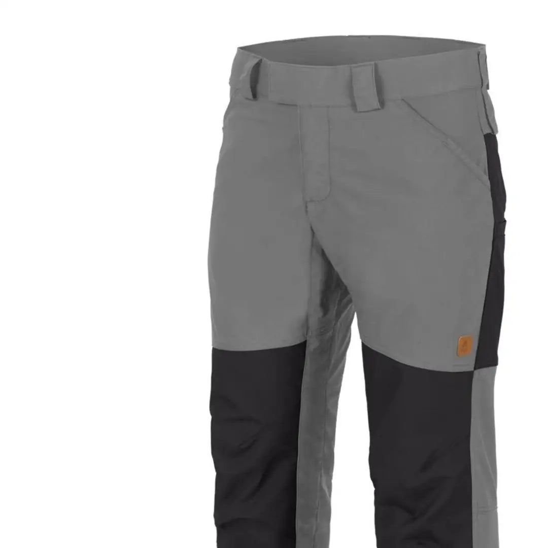 Gray and black Helikon-Tex Woodsman Pants for outdoor enthusiasts with reinforced knees