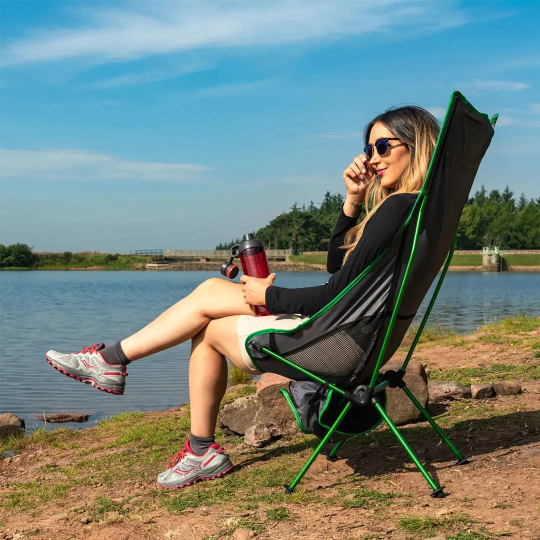 Portable Ayr Rest Camping Chair with green frame and black fabric seat for outdoor comfort