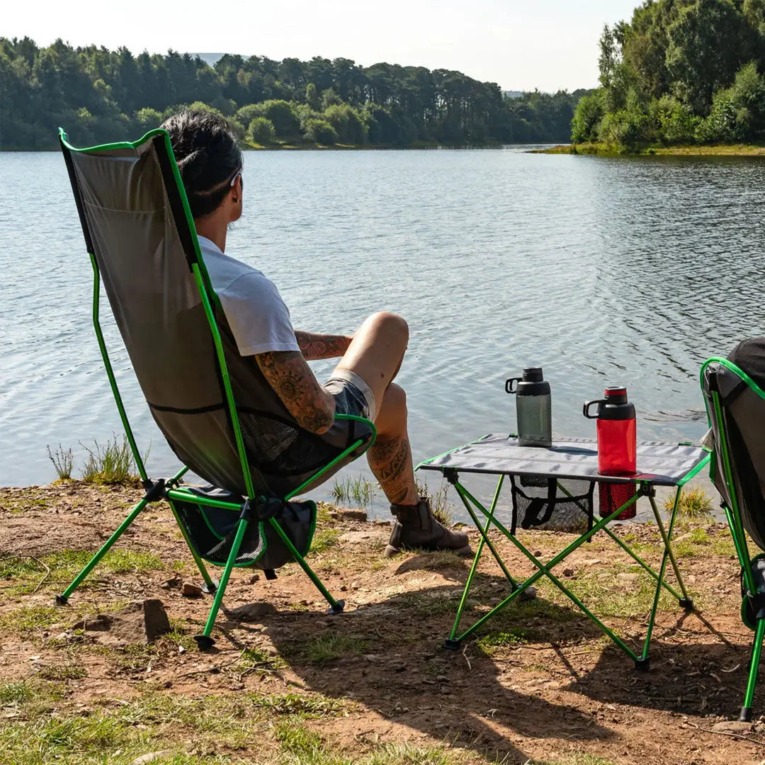 Folding Highlander Ayr Rest Camping Chair with green frame and dark fabric seat