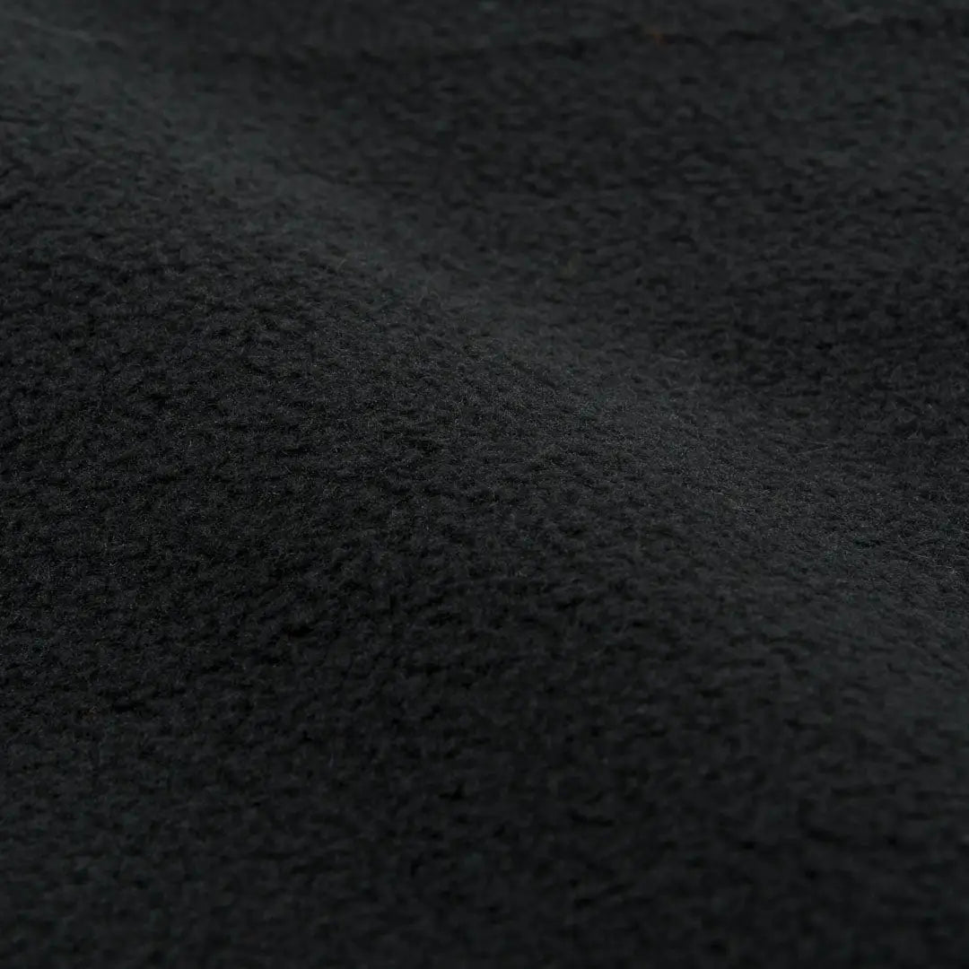 Dark, textured surface of Highlander Mummy Fleece Sleeping Bag Liner for country clothing