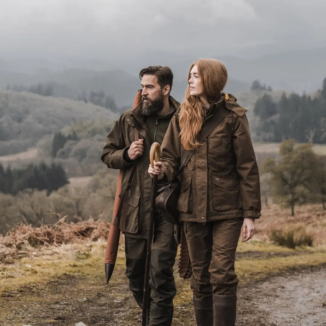 Couple in Hoggs of Fife Ballater Waterproof Field Jacket on a rural path in the Scottish Highland