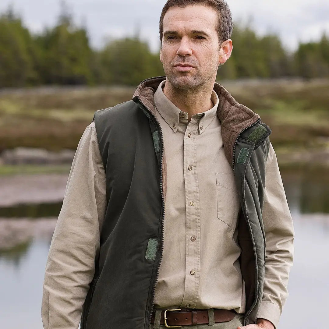 Man in button-up shirt and vest showcasing Hoggs Of Fife Breezer II Bodywarmer outdoors