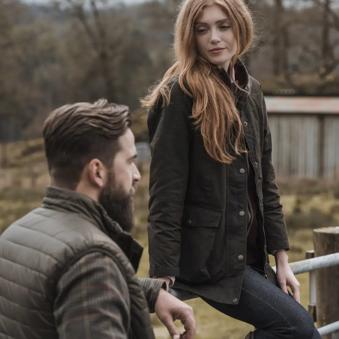 Two people outdoors, showcasing the Fife Caledonia Ladies Wax Jacket in style