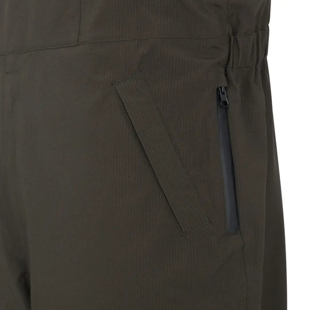 Dark-colored pants with zippered side pocket from Hoggs of Fife Green King II Thermal Bib