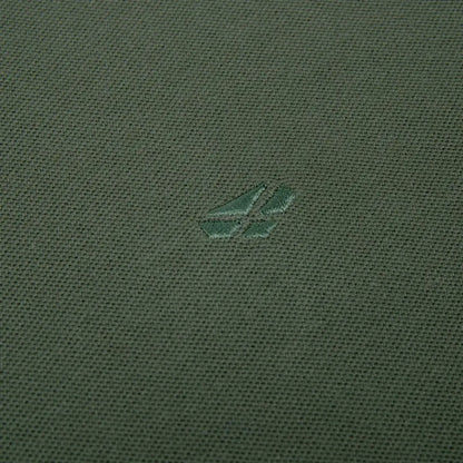 Green fabric featuring a small logo on the Hoggs Of Fife Largs Polo shirt