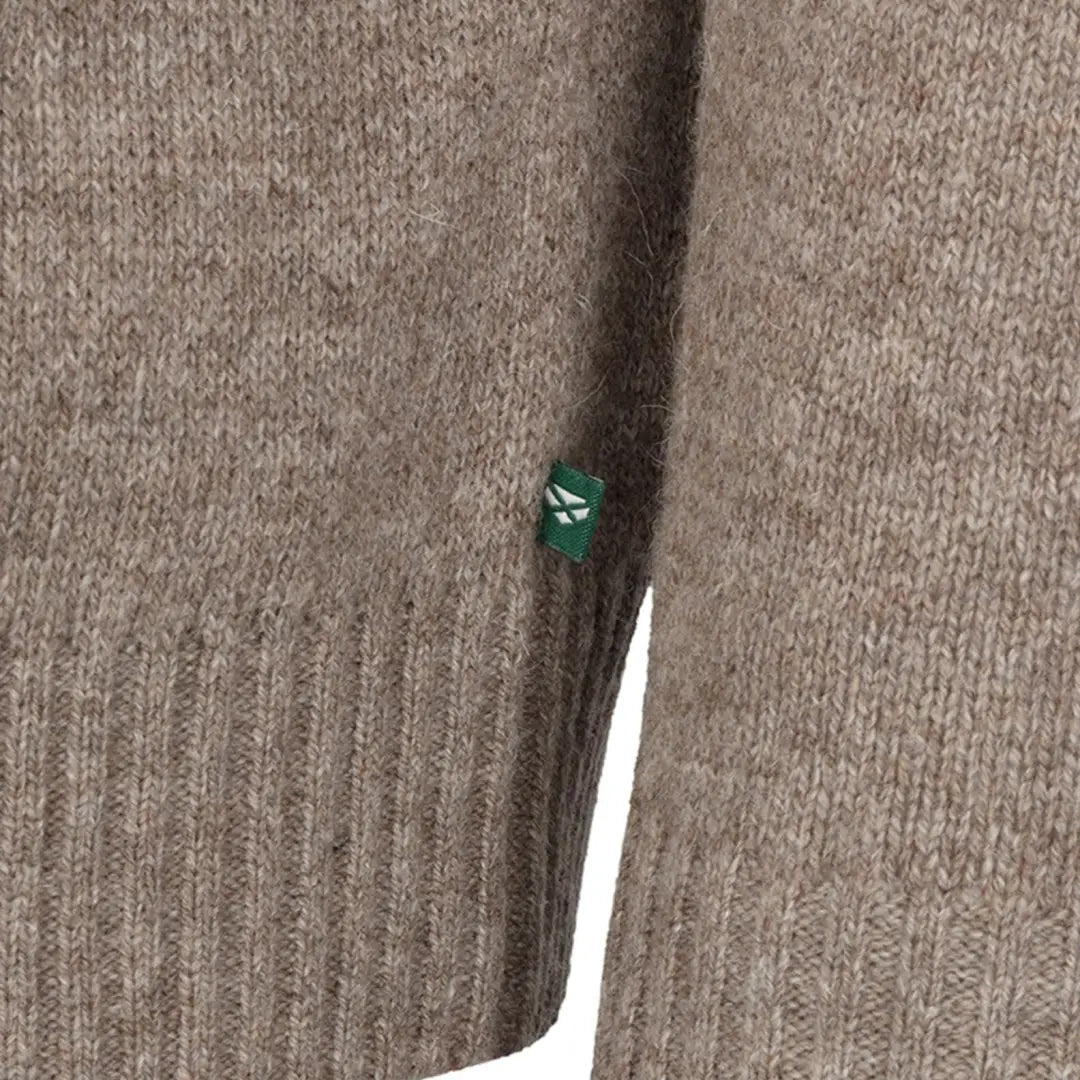 Knitted Hoggs of Fife Lothian II zip pullover in oatmeal with a green button detail