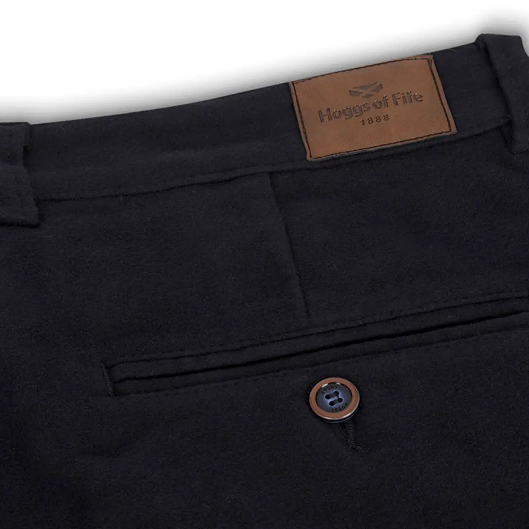 Black dress pants with leather label and button detail in Monarch Moleskin fabric