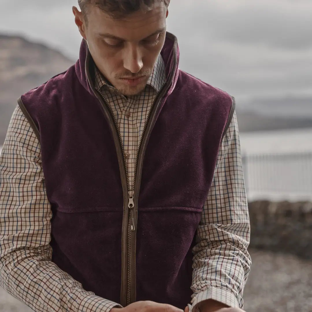 Maroon fleece vest over a checkered shirt, perfect for your Hoggs of Fife Stenton Technical Fleece