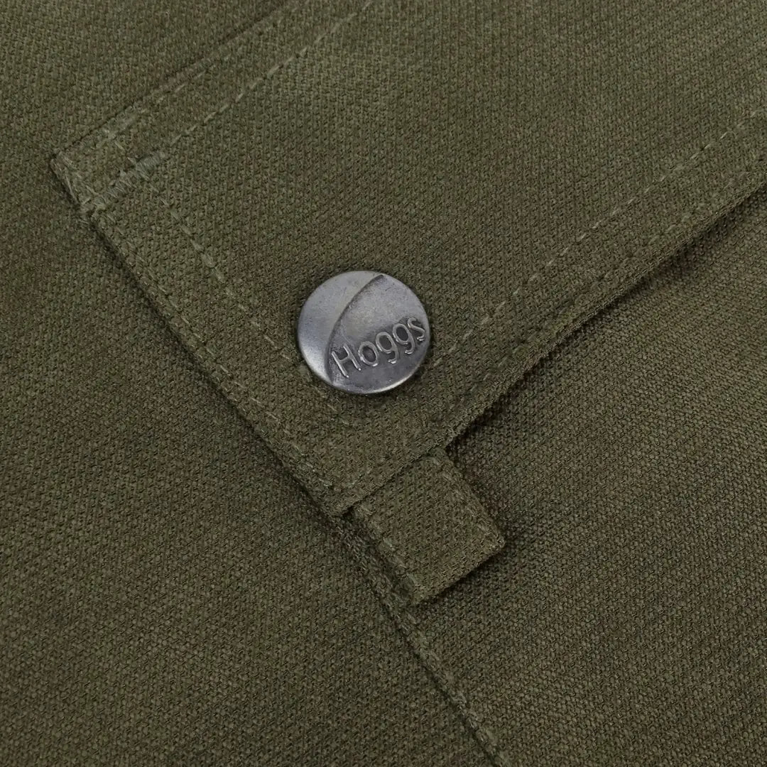 Metal button with Hoggs engraved on olive green fabric of Fife Struther Field Trousers