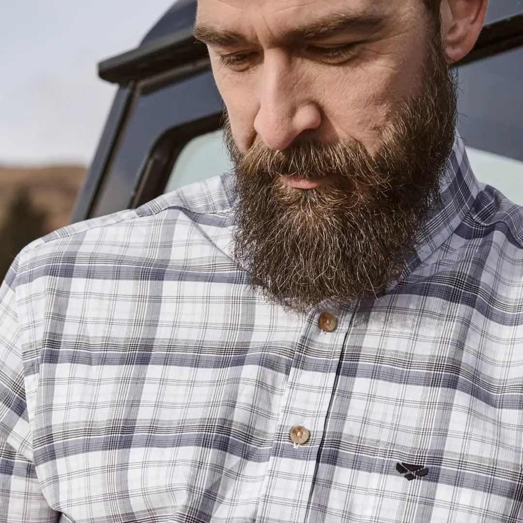 Bearded man in a plaid Hoggs of Fife Tresness short sleeve shirt