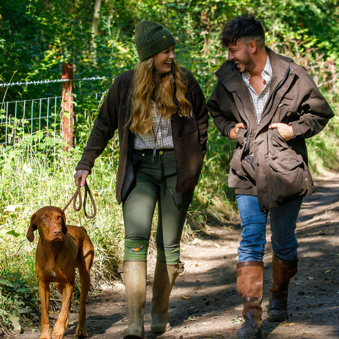 Couple enjoying a stroll with their dog in a Jack Pyke Ashcombe Jacket