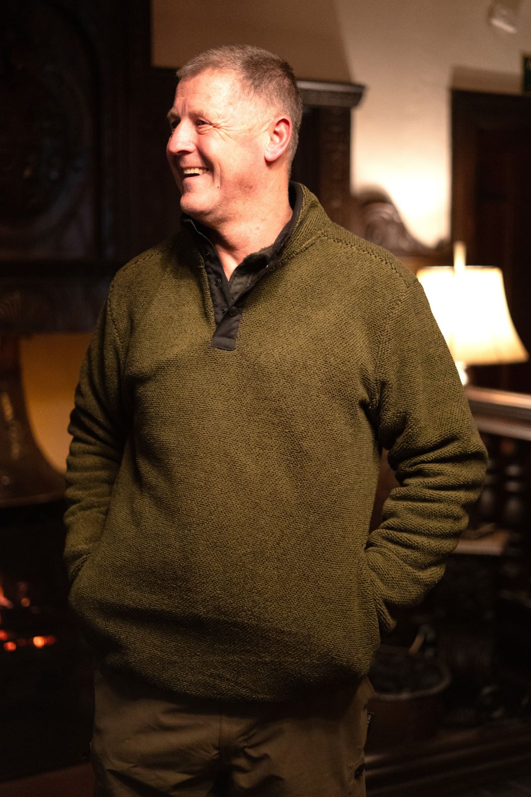 Smiling man in green fleece wearing the Jack Pyke Ashdown Fleece, a versatile essential