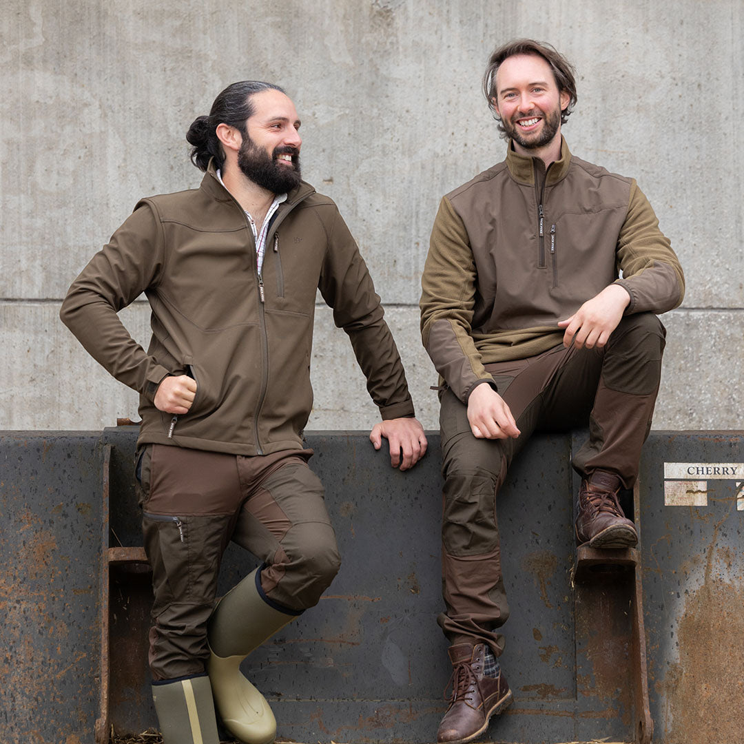 Two men in brown outdoor clothing wearing the Jack Pyke Bleasdale Softshell Jacket