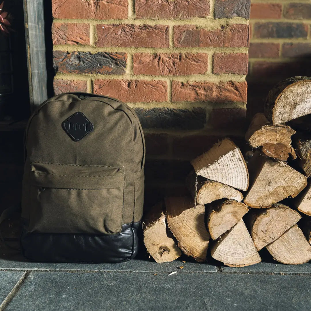 Olive green Jack Pyke Canvas Backpack with black bottom and comfy shoulder straps