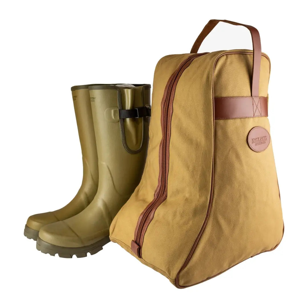 Jack Pyke Canvas Boot Bag with leather trim beside olive green rubber boots